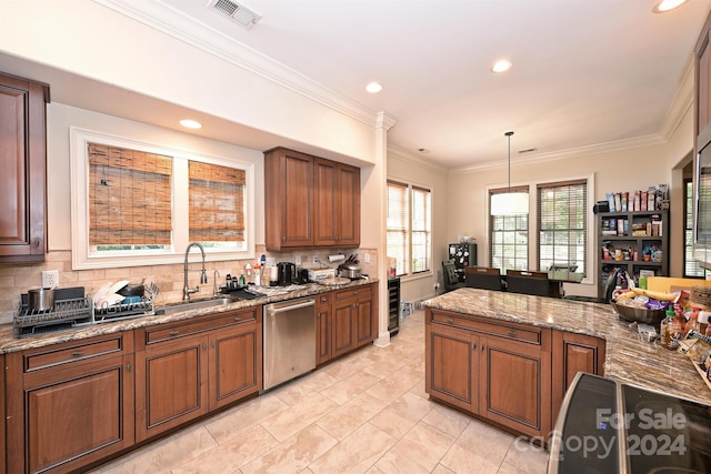 kitchen featuring dishwasher, sink, decorative backsplash, decorative light fixtures, and light stone countertops