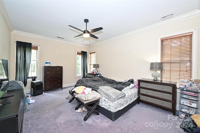 bedroom featuring ceiling fan, ornamental molding, and carpet