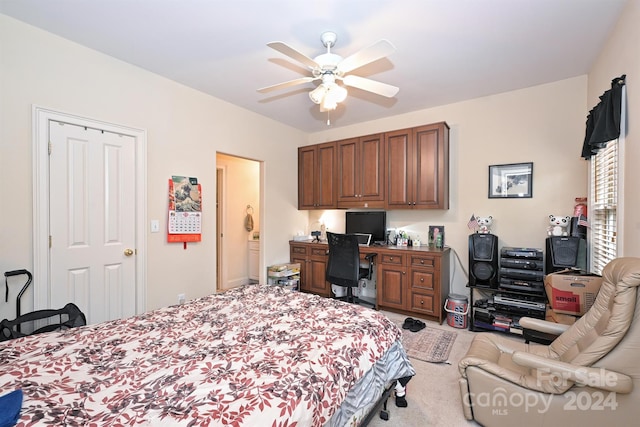 bedroom with built in desk, carpet flooring, and ceiling fan