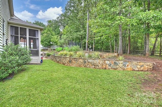 view of yard featuring a sunroom