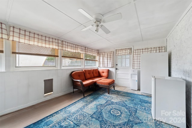 living area with ceiling fan