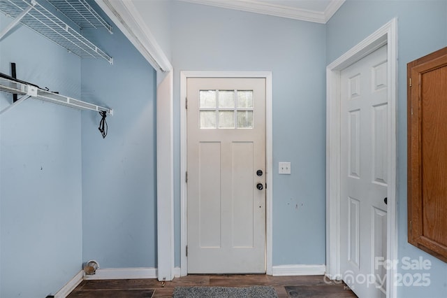 entryway featuring dark wood-type flooring and ornamental molding