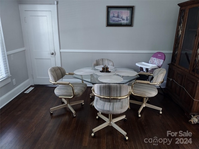 dining space featuring dark hardwood / wood-style floors