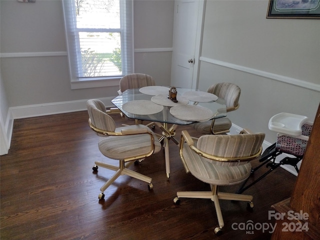 dining space featuring dark wood-type flooring