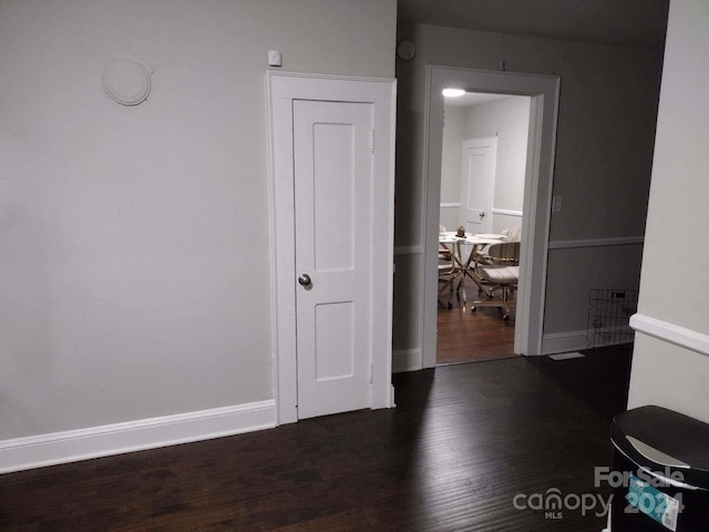 interior space with dark hardwood / wood-style floors