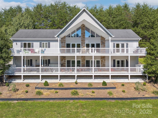 rear view of property with a balcony