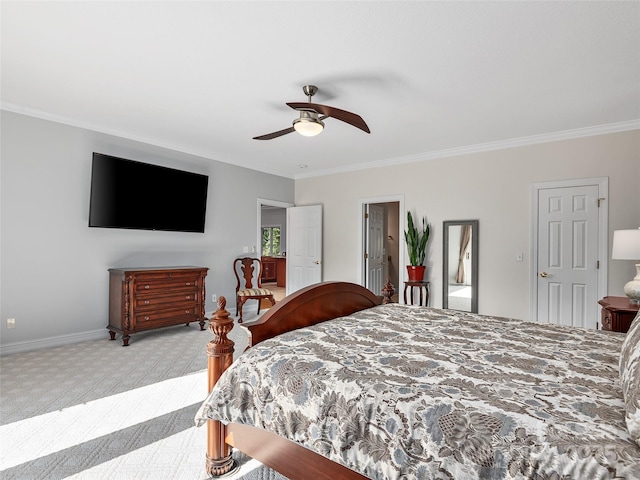 carpeted bedroom featuring ceiling fan and crown molding