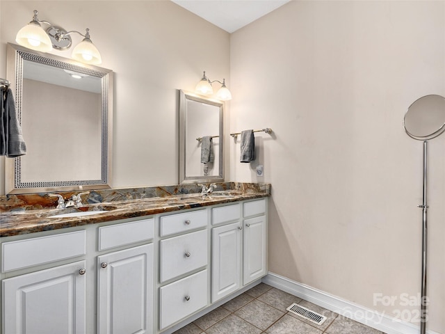 bathroom with vanity and tile patterned flooring