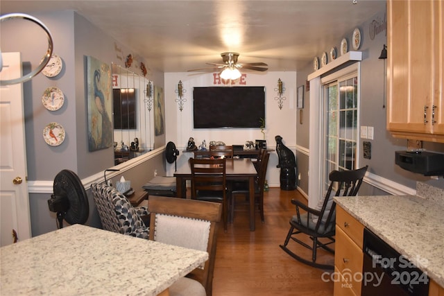 dining space featuring dark wood-type flooring and ceiling fan