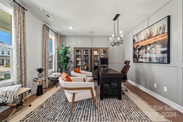 interior space featuring hardwood / wood-style floors and a chandelier