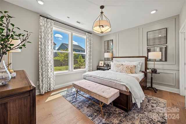 bedroom with light hardwood / wood-style flooring