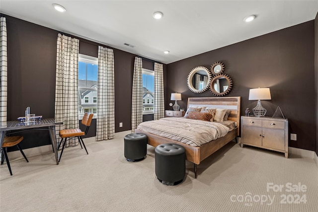 bedroom with light colored carpet