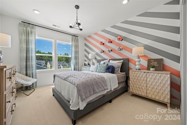 bedroom with light carpet and an inviting chandelier