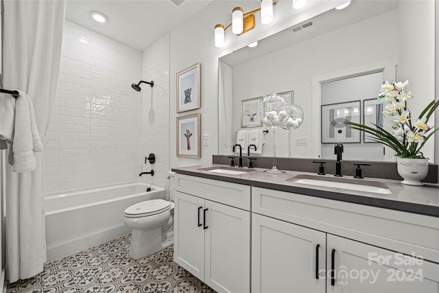 full bathroom featuring vanity, toilet, and shower / bathtub combination with curtain