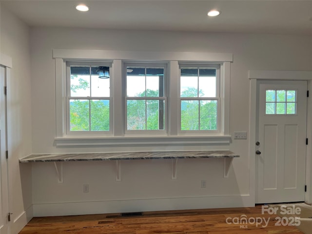 entryway with dark wood-type flooring