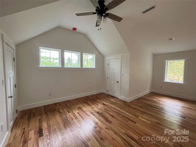 71 Crossings Cir, Fairview, NC 28730 - unfurnished bedroom featuring wood finished floors, lofted ceiling, and a ceiling fan