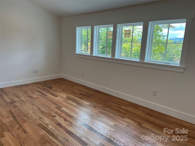 71 Crossings Cir, Fairview, NC 28730 - empty room featuring baseboards and wood finished floors