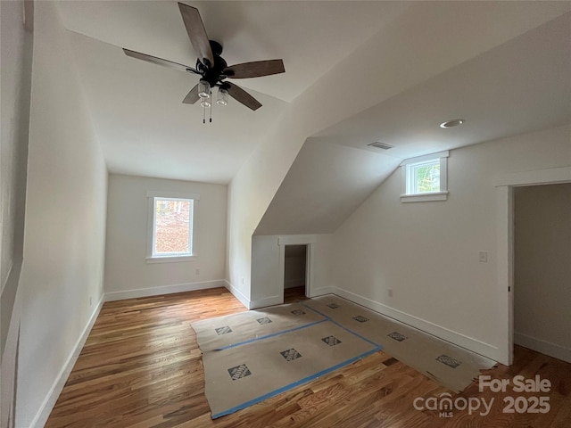 71 Crossings Cir, Fairview, NC 28730 - additional living space with healthy amount of natural light, vaulted ceiling, wood finished floors, and ceiling fan