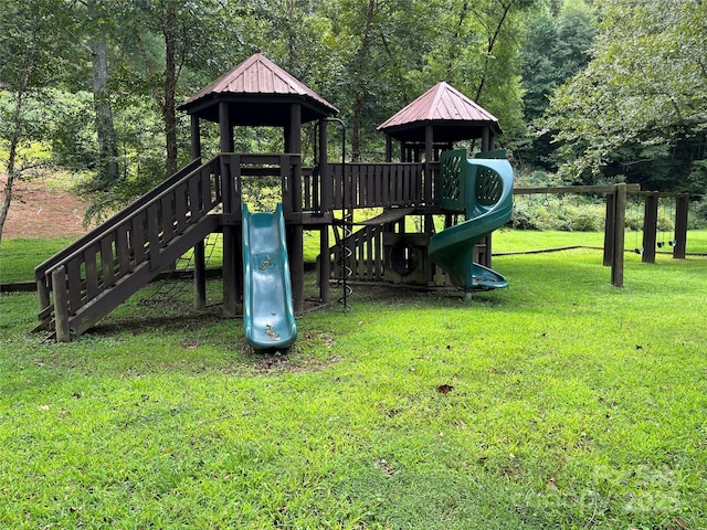 view of playground with a lawn