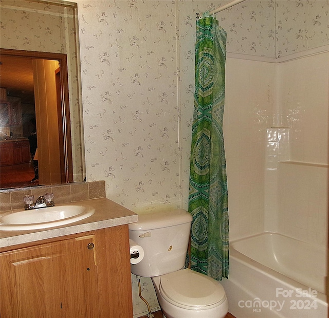 full bathroom featuring vanity, toilet, and shower / bath combo with shower curtain