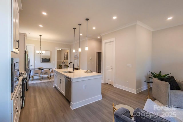 kitchen featuring sink, white cabinets, an island with sink, and dark hardwood / wood-style floors