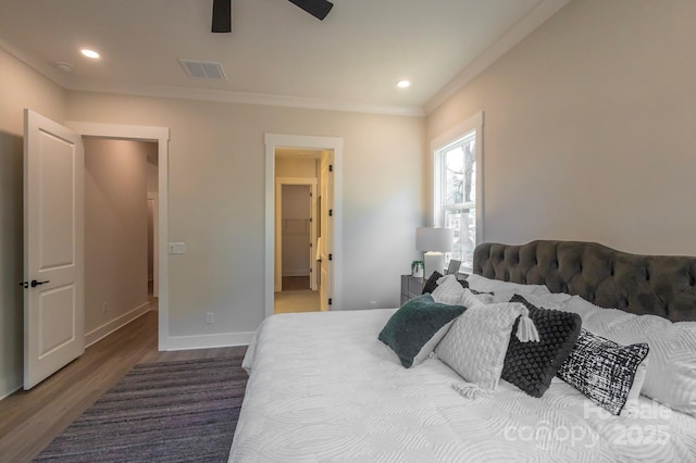 bedroom with ceiling fan, crown molding, and hardwood / wood-style floors