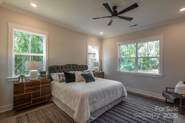 bedroom featuring ceiling fan, dark hardwood / wood-style flooring, and ornamental molding