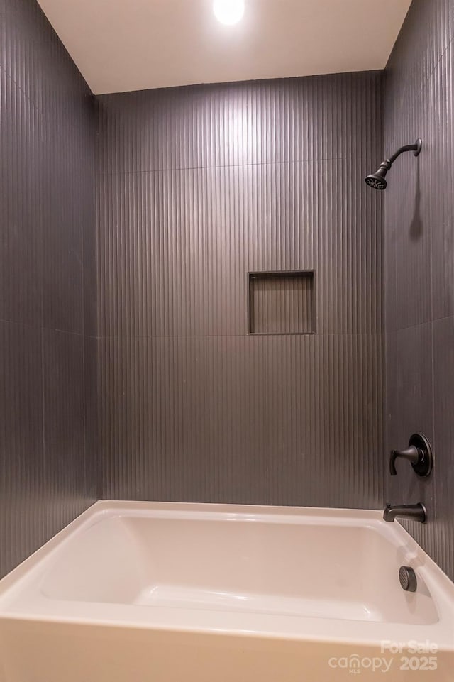 bathroom with shower / bath combination