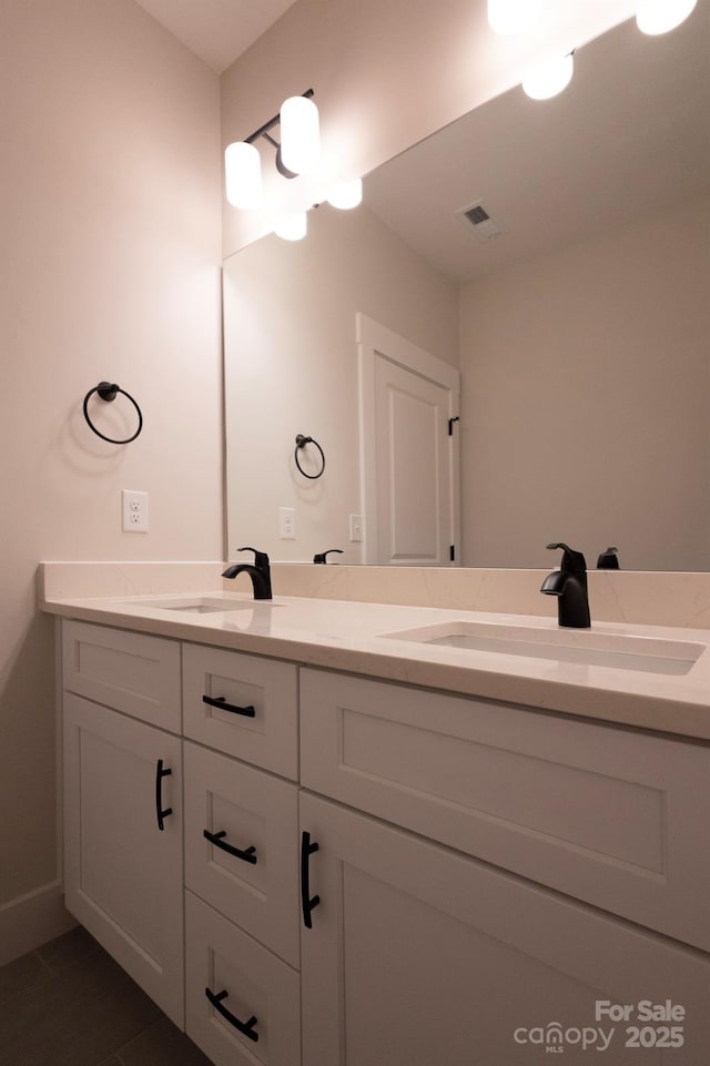 bathroom featuring tile patterned floors and vanity