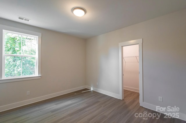 empty room with dark hardwood / wood-style floors