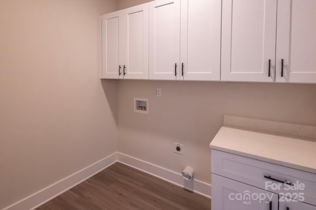 laundry area featuring cabinets, washer hookup, dark hardwood / wood-style floors, and electric dryer hookup