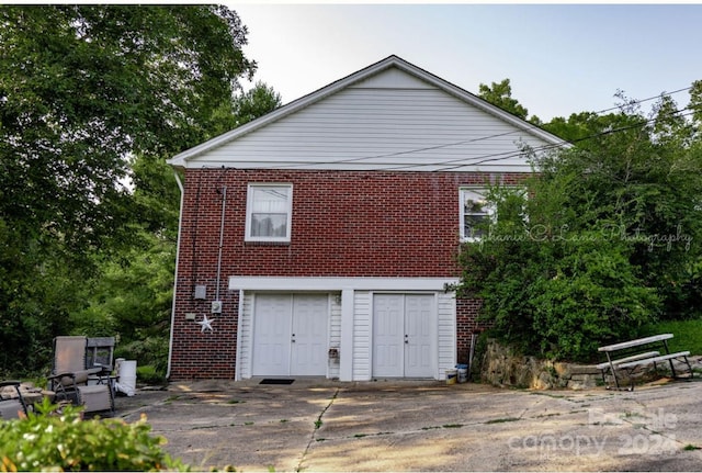 view of home's exterior with brick siding