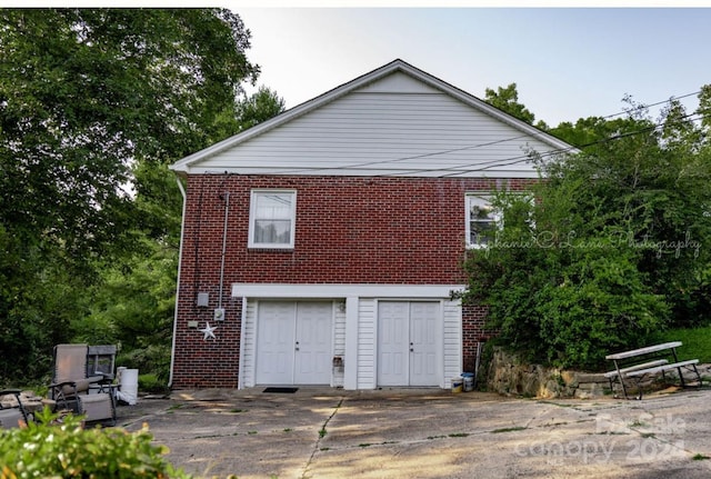 view of property exterior with brick siding