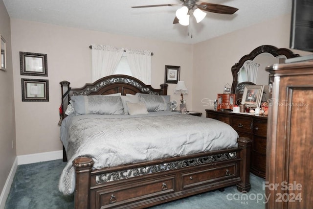 carpeted bedroom featuring a ceiling fan and baseboards