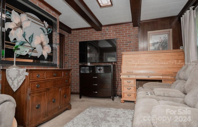 living room with beam ceiling, light colored carpet, and brick wall