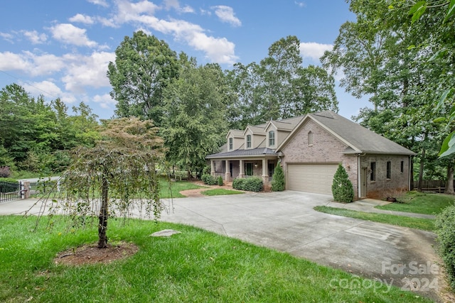 view of front of house with a front lawn and a garage