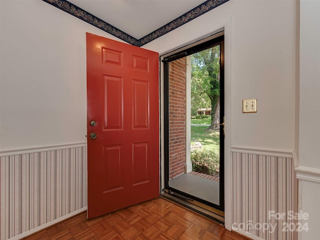 foyer featuring wainscoting