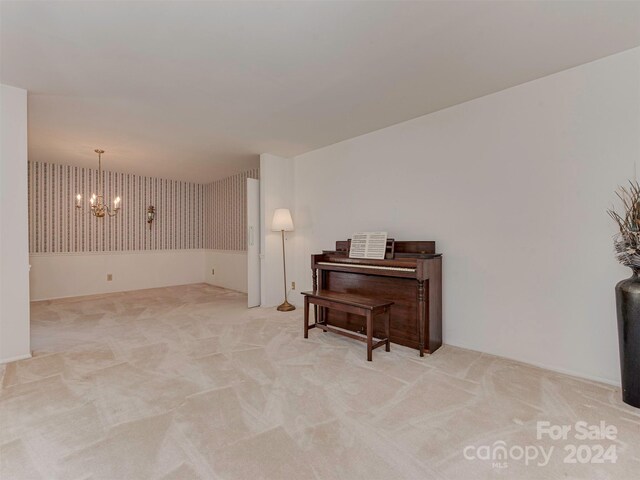 interior space featuring light colored carpet and an inviting chandelier