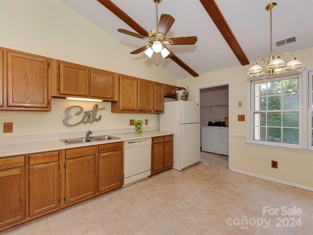 kitchen featuring hanging light fixtures, sink, lofted ceiling with beams, white appliances, and washer and dryer