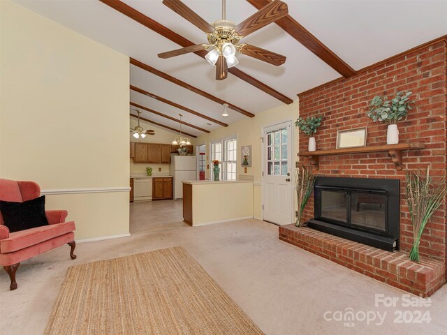 carpeted living room with vaulted ceiling with beams and a fireplace