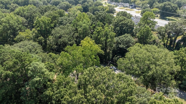 aerial view with a wooded view