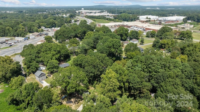 drone / aerial view featuring a view of trees