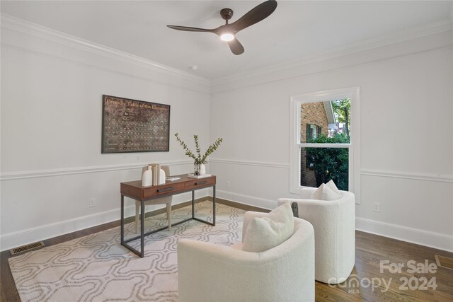 office featuring hardwood / wood-style flooring, ceiling fan, and crown molding