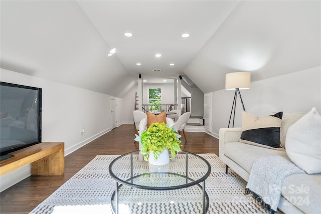 living room with dark wood-type flooring and lofted ceiling