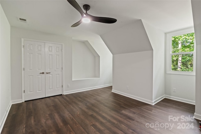 bonus room with ceiling fan, dark hardwood / wood-style flooring, and vaulted ceiling