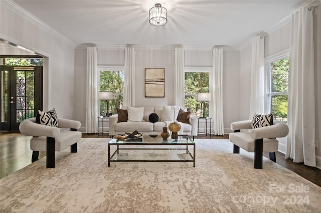 interior space with a chandelier, dark hardwood / wood-style flooring, plenty of natural light, and crown molding