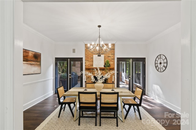 dining room with crown molding, dark wood-type flooring, a chandelier, and plenty of natural light