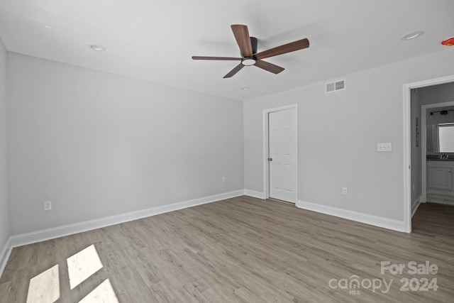 unfurnished bedroom featuring light hardwood / wood-style flooring and ceiling fan