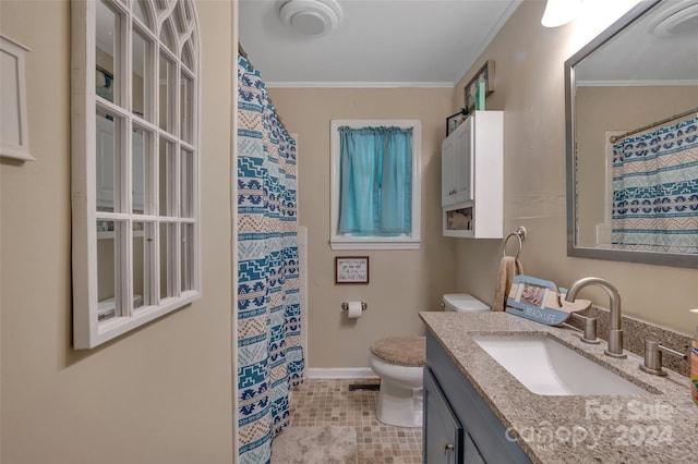 bathroom featuring ornamental molding, baseboards, vanity, and toilet