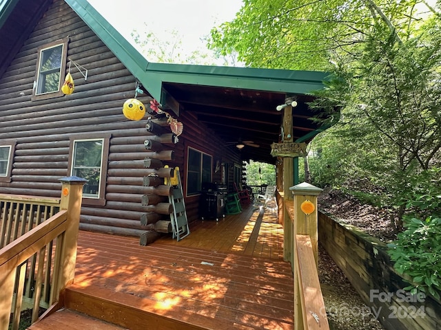 wooden terrace featuring grilling area